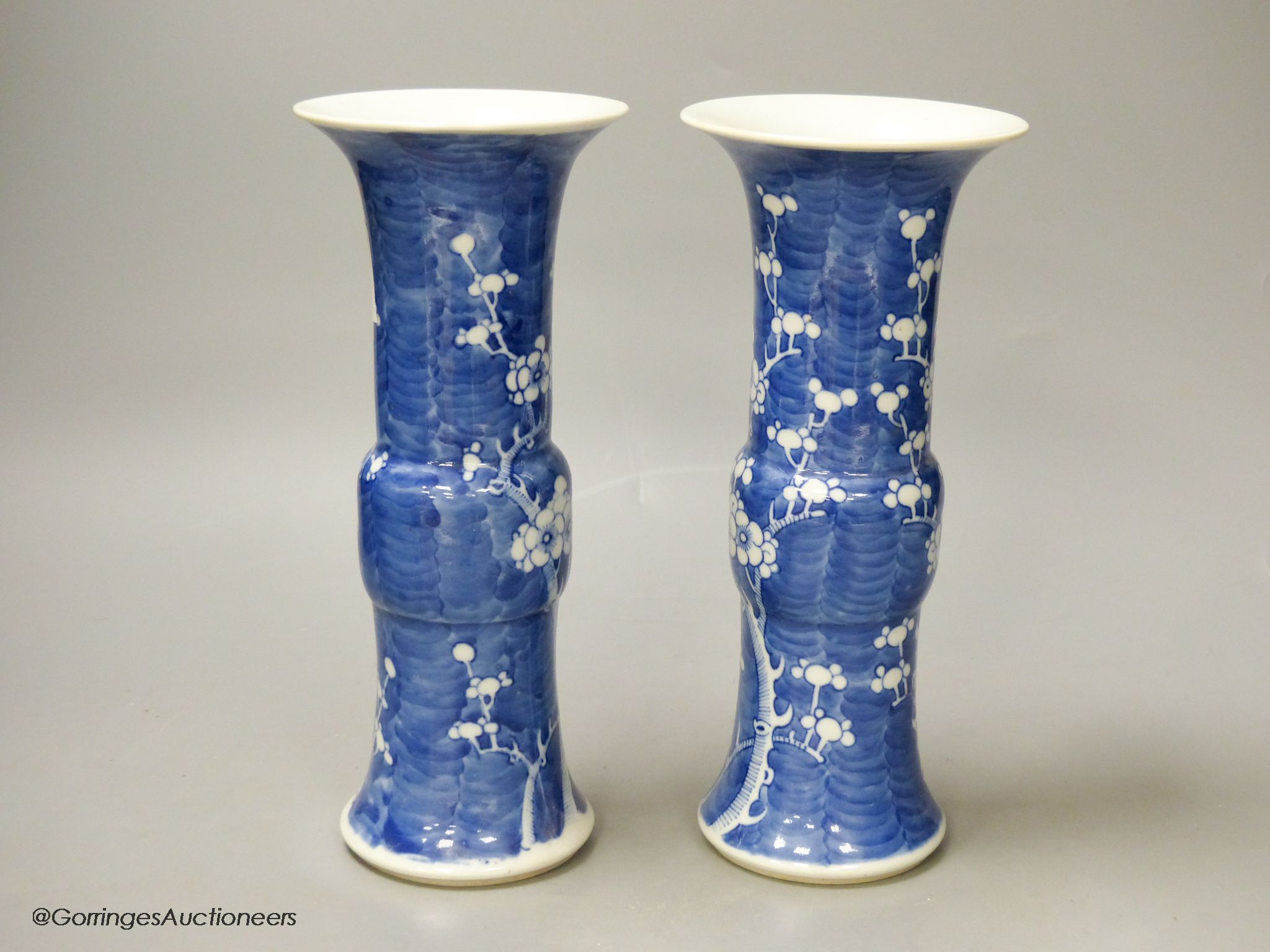 A pair of late 19th century Chinese blue and white prunus vases